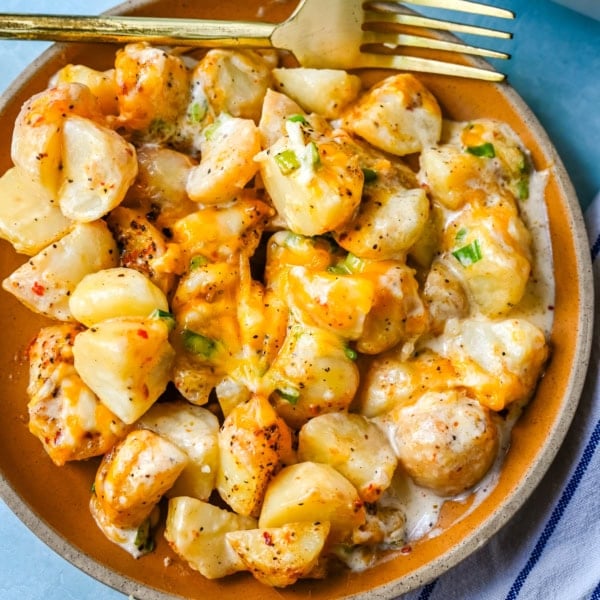 Perfect for family dinners or holiday tables, these creamy potatoes are savory, rich, and the perfect comfort food. These Kerry's Special Potatoes start with buttery, creamy yukon gold potatoes, and topped with seasoned salt and pepper, heavy cream, cheddar cheese, and sprinkled with green onions. You only need 6 ingredients to make these special potatoes.